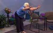 standing woman bends forward and reaches out with both arms